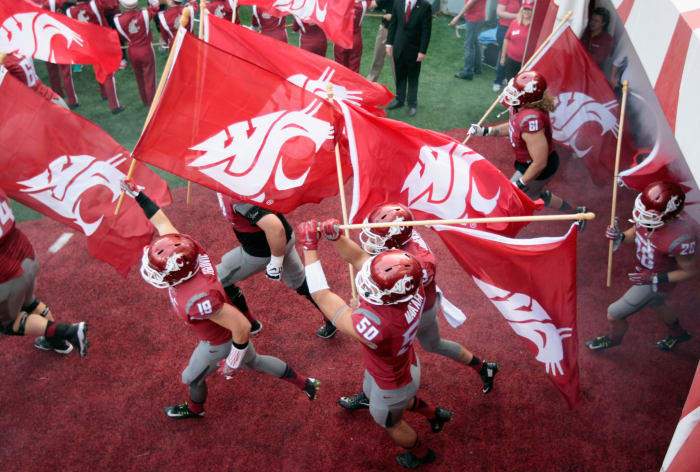 The Washington State Cougars take the field against the Oregon State Beavers in a Pac-12 football game.