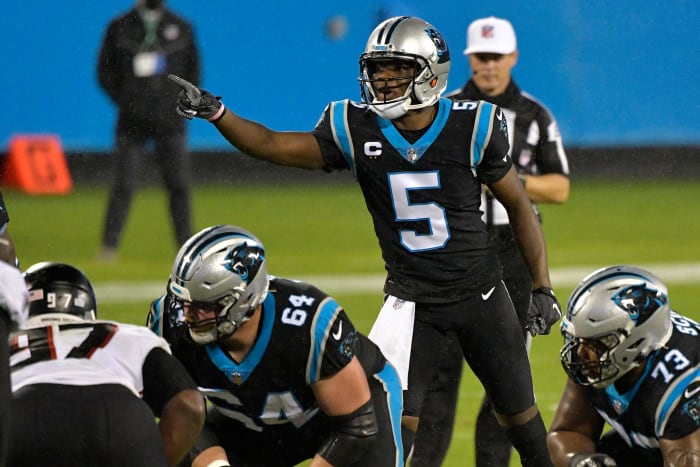 Carolina Panthers QB Teddy Bridgewater makes a call during an NFL game.