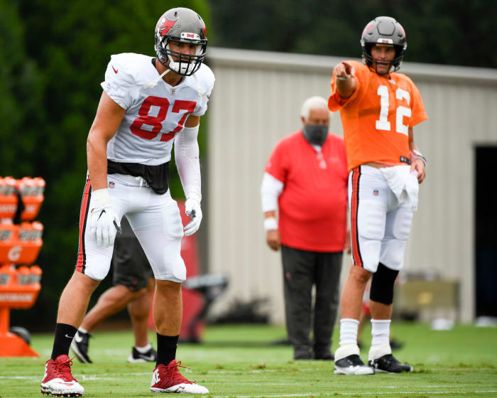 Tom Brady points to long time teammate Rob Gronkowski during Tampa Bay Buccaneers training camp.