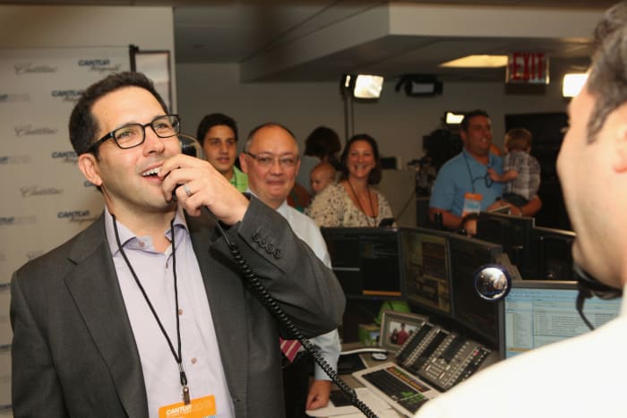 Adam Schefter speaking on the phone.