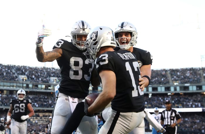 Raiders stars Hunter Renfrow, Derek Carr, Darren Waller celebrate a touchdown.