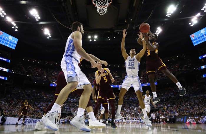 A floor's eye shot of Iona guard Asante Gist attempting a shot vs. UNC.