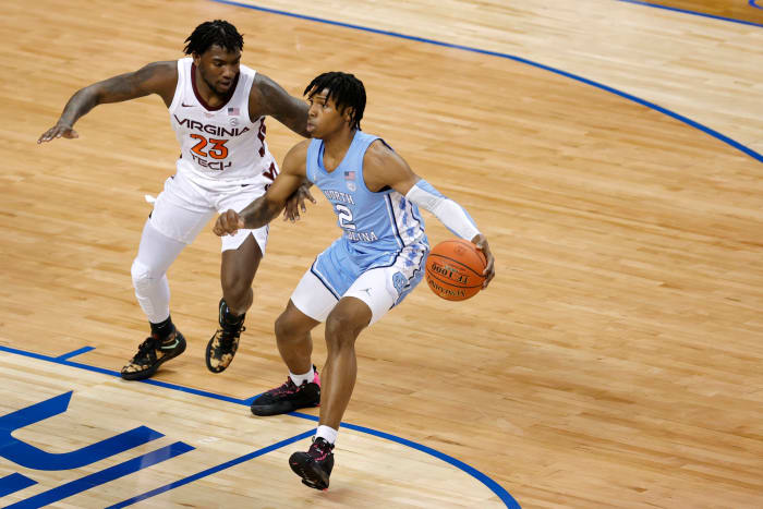 North Carolina guard Caleb Love dribbling the ball against Virginia Tech.