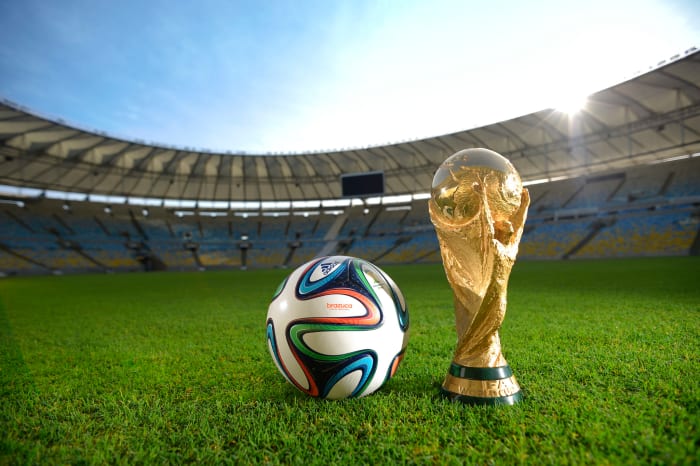 A generic photo of the World Cup trophy and official ball.
