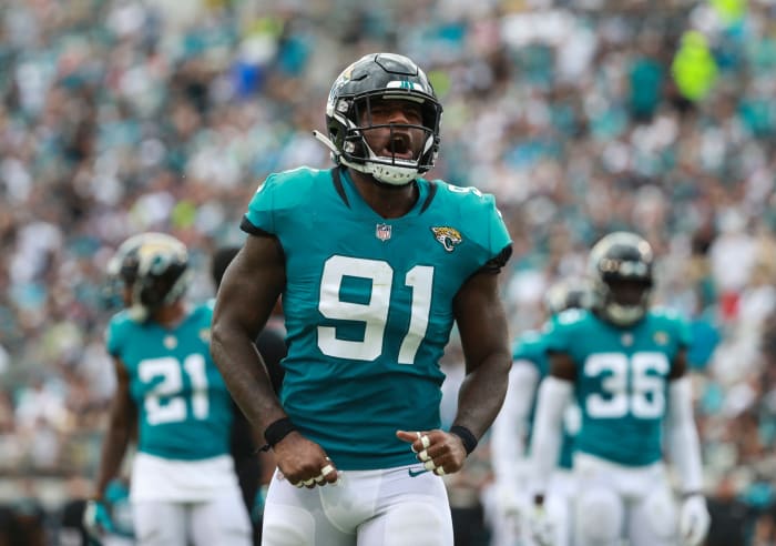 Yannick Ngakoue celebrates on the field.
