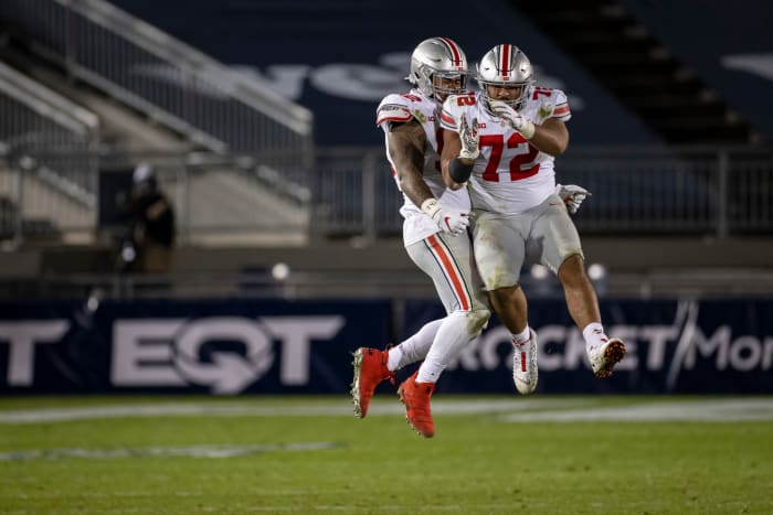 Tommy Togiai celebrates with his Ohio State teammates.