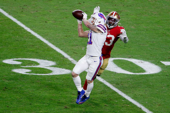 Bills wide receiver Cole Beasley makes a catch in front of a defender.