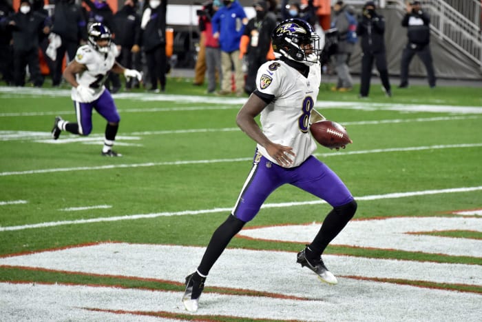 Lamar Jackson #8 of the Baltimore Ravens rushes for a touchdown during the first quarter against the Cleveland Browns