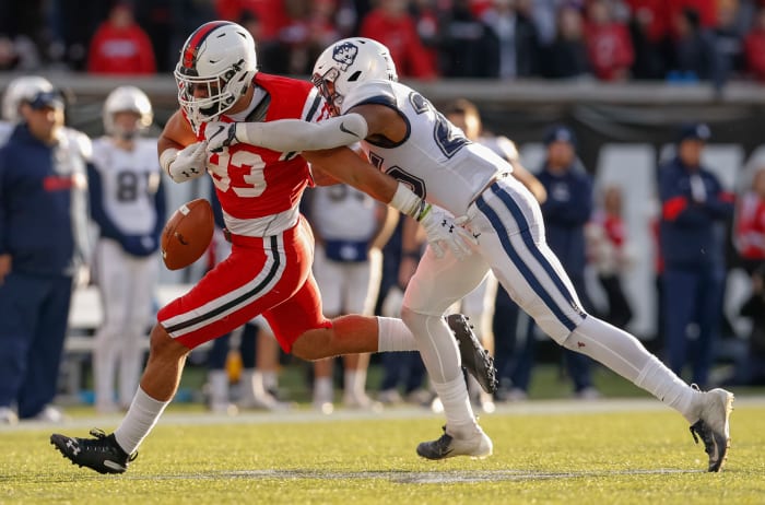 Tyler Coyle forces a fumble for Connecticut.