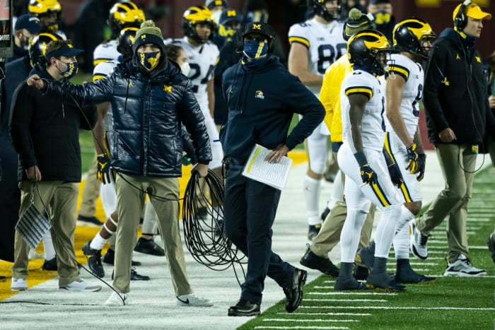 Jim Harbaugh looks on against Minnesota