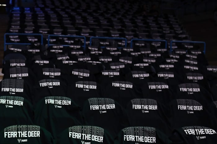 Milwaukee Bucks playoff t-shirts sitting on empty seats.