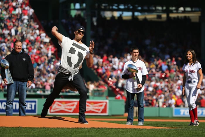 Tom brady throws the first pitch at a Red Sox game.
