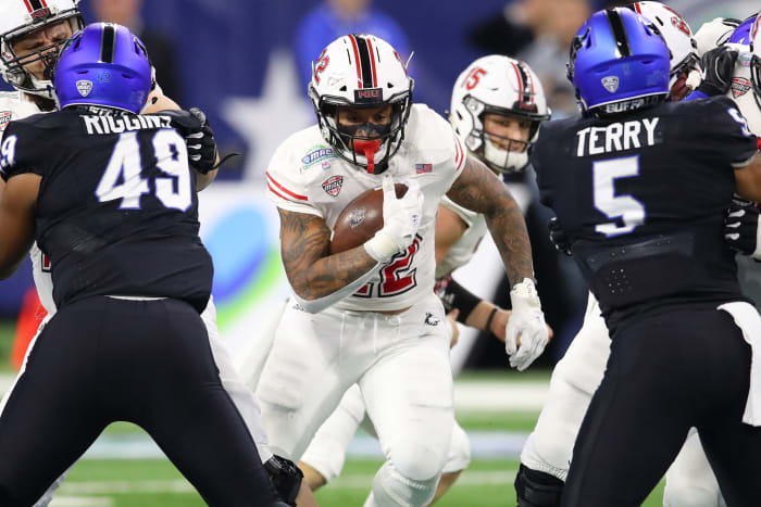 College football game between Northern Illinois and Buffalo face off in the MAC football Championship.