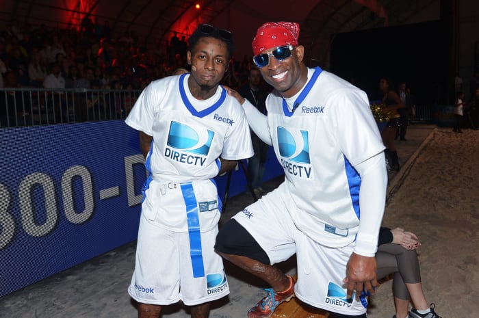 Deion Sanders and Lil Wayne at a celebrity Super Bowl week event.