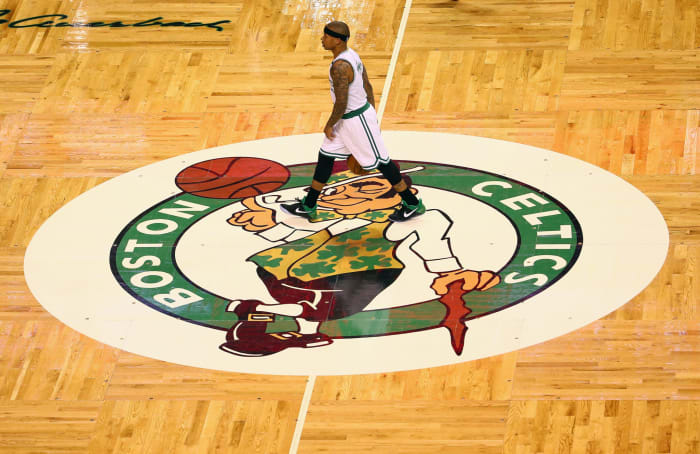 Isaiah Thomas walking across the Boston Celtics court.