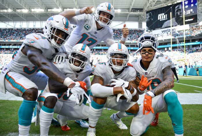Members of the Miami Dolphins celebrating a TD.