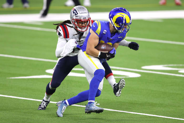 Rams WR Cooper Kupp is tackled by a member of the Patriots.