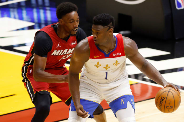 Zion Williamson being defended by Bam Adebayo.