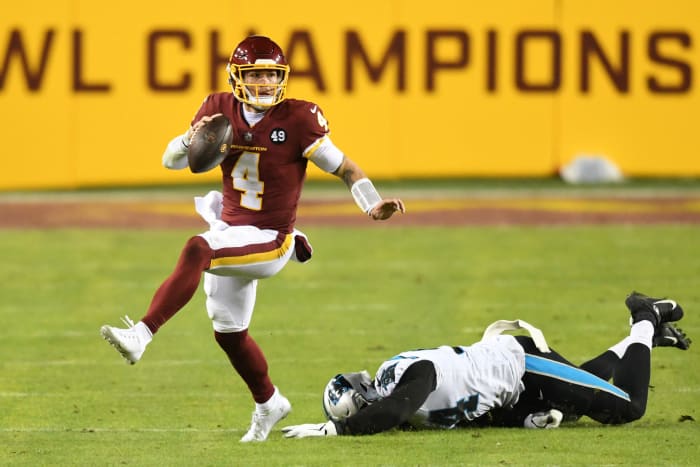 Washington Football Team quarterback Taylor Heinicke scrambles.