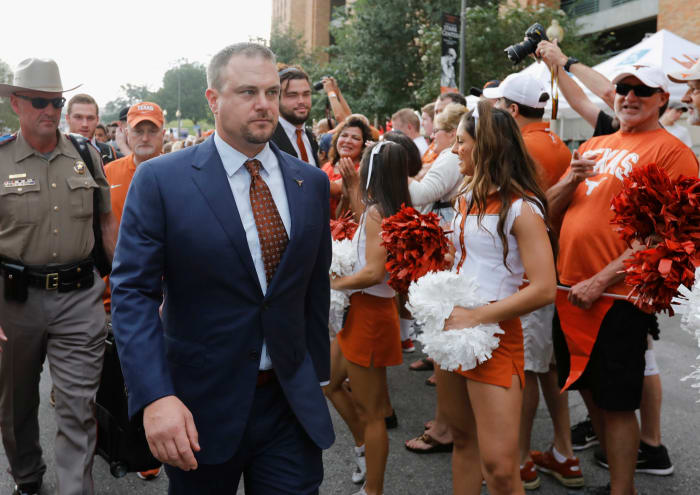 Tom Herman walking into the Texas Longhorns stadium.