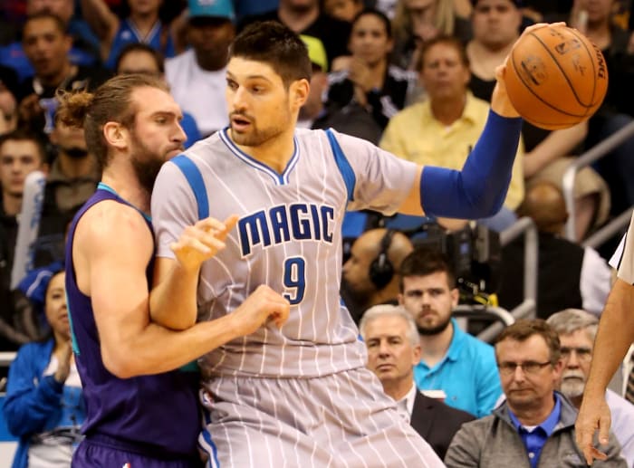 Nikola Vucevic posting up during a game.