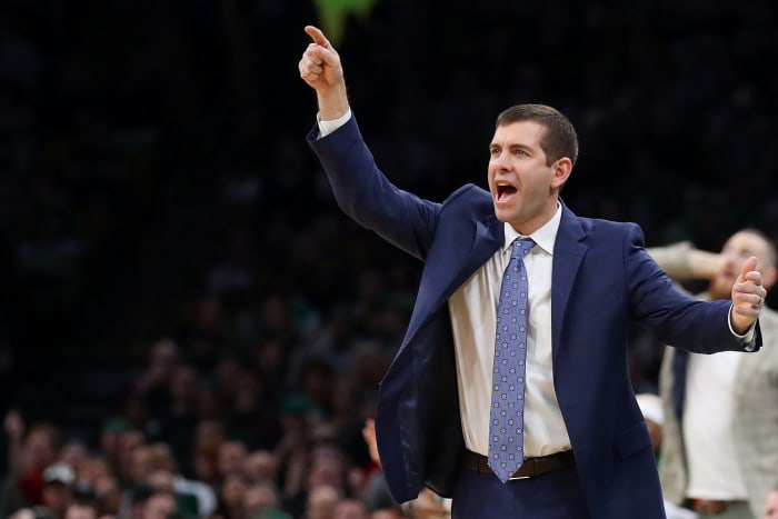 A closeup of Boston Celtics coach Brad Stevens pointing during a game.