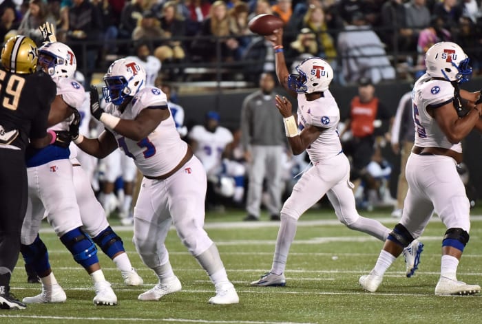 A Tennessee State quarterback throws a pass in a game.