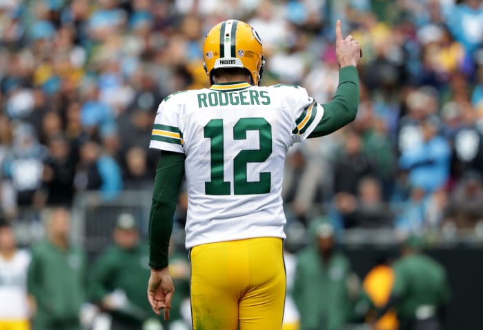 A photo of Green Bay Packers quarterback Aaron Rodgers raising his right pointer finger.