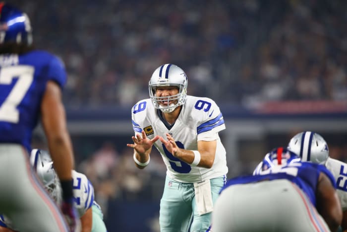 Tony Romo taking a snap.