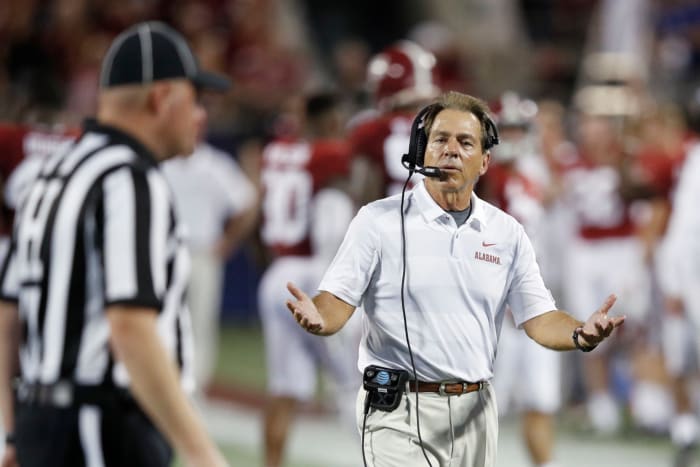 Nick Saban questioning a referee.