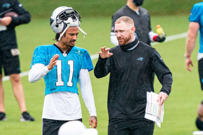 Carolina Panthers offensive coordinator Joe Brady speaks to Robby Anderson.