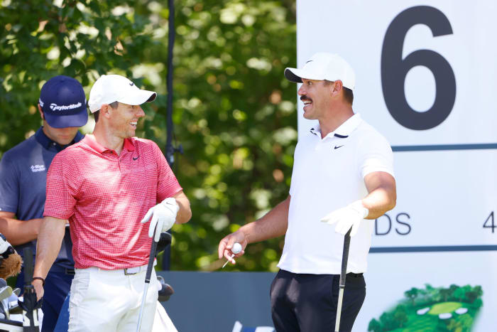 Brooks Koepka and Rory McIlroy joking around.