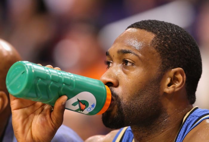 Gilbert Arenas drinking out of a Gatorade bottle.