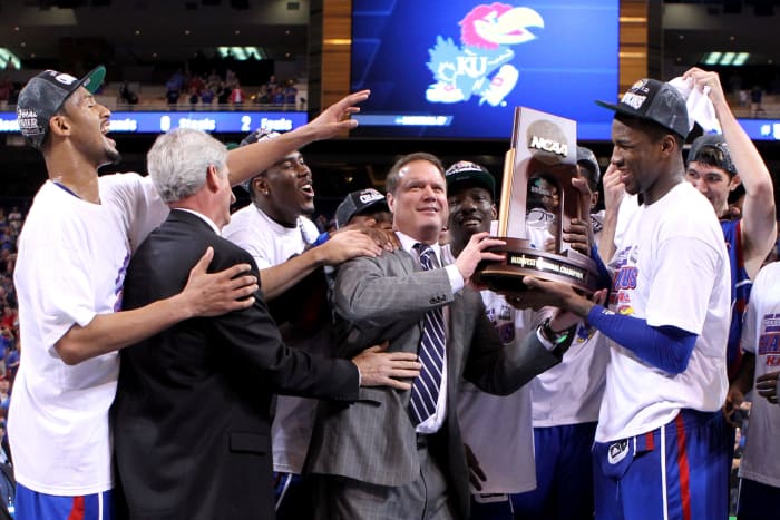 Bill Self raising the Big 12 basketball trophy.