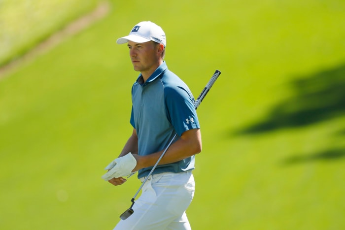 A closeup of Jordan Spieth on the golf course.