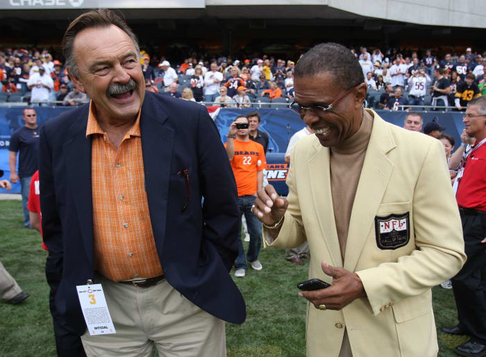Dick Butkus and Gale Sayers laughing.