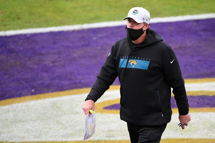 Jay Gruden walks across the field.