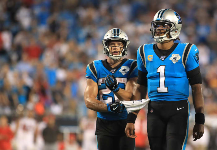 Christian McCaffrey runs alongside Cam Newton on the Panthers.