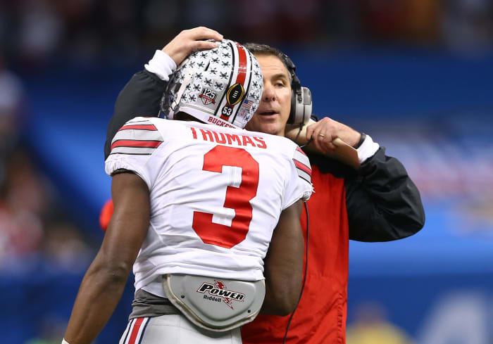urban meyer hugs michael thomas during ohio state's win over alabama