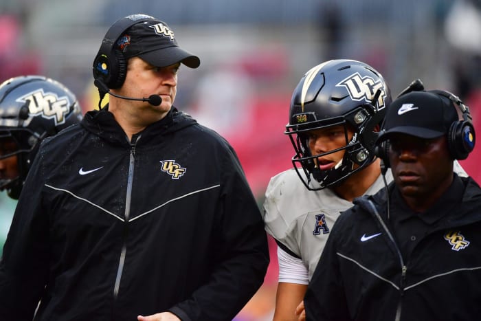UCF coach Josh Heupel talks to Dillon Gabriel during bowl game.