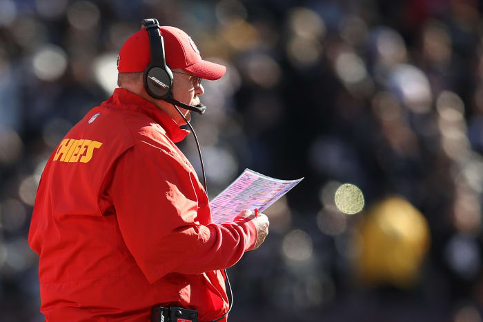 A closeup of Kansas City Chiefs coach Andy Reid calling a play.