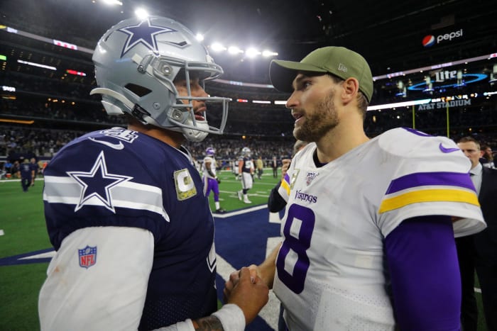 Dak Prescott #4 of the Dallas Cowboys shakes hands with Kirk Cousins #8 of the Minnesota Vikings