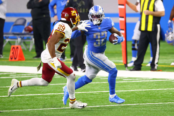 D'Andre Swift of the Detroit Lions attempts to carry the ball