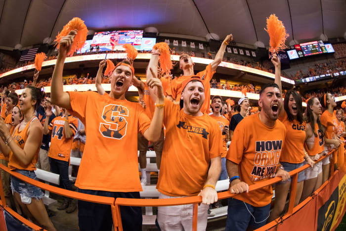 Syracuse fans cheering at a football game.