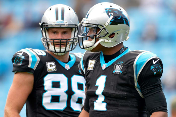 Greg Olsen and Cam Newton warm up before game.