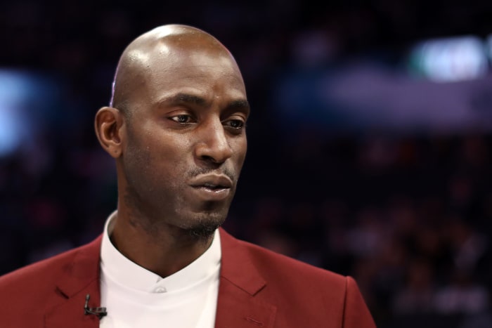 Kevin Garnett wearing a red suit.