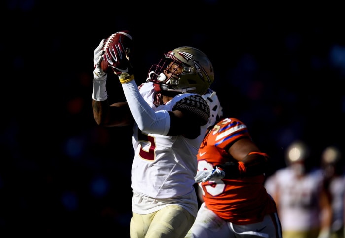 SEC football power florida and florida state of the ACC players on the field