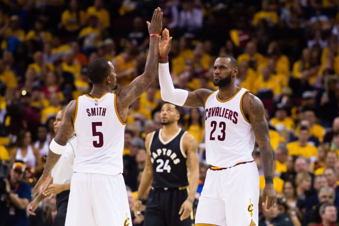JR Smith and LeBron James high five.