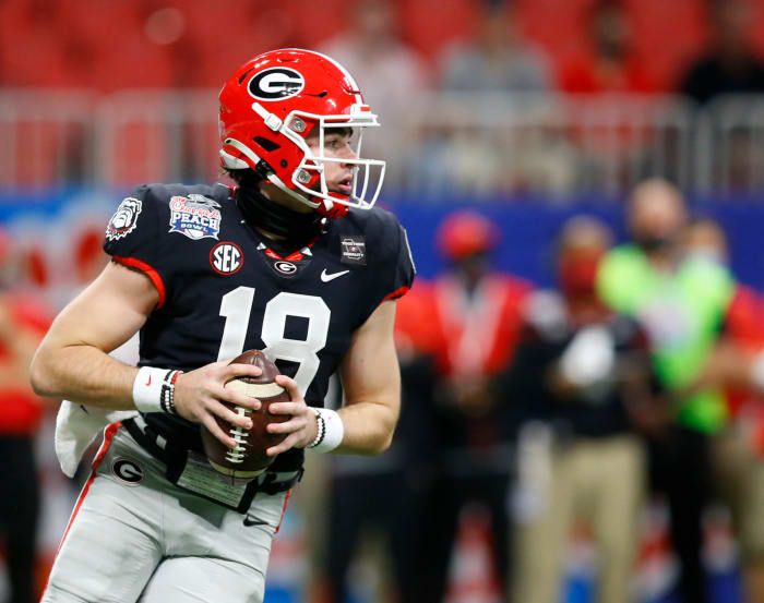 JT Daniels drops back to pass.