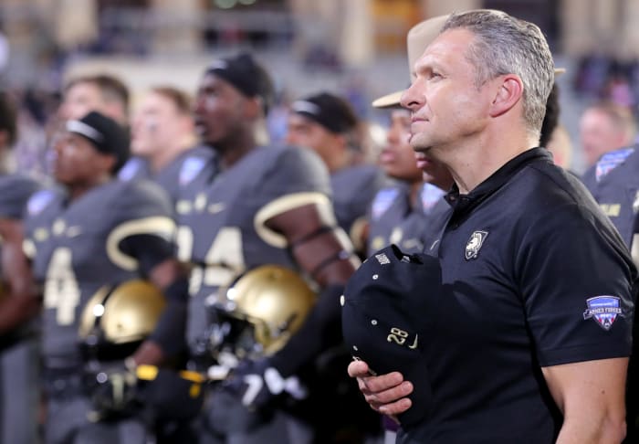 Jeff Monken stands for the Army fight song.